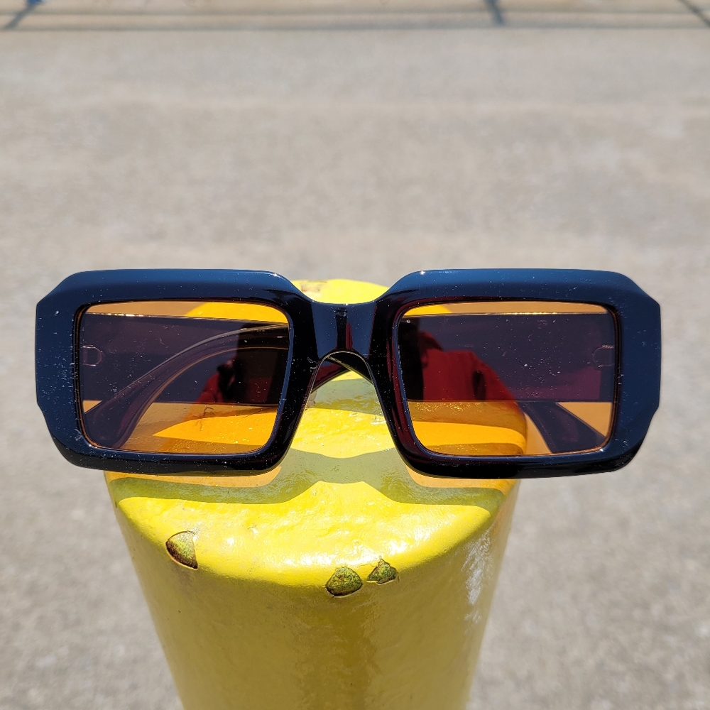 Black frame sunglasses with yellow lens